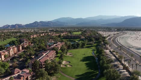 Low-aerial-shot-flying-over-a-resort-golf-course-in-Palm-Desert