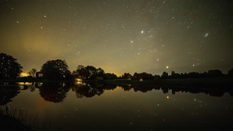 Milky-way-starry-sky-reflecting-calm-lake-water,-fusion-time-lapse