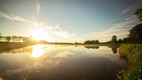 Amazing-sunrise-to-sunset-all-day-time-lapse-with-the-sky-reflecting-off-the-surface-of-a-lake