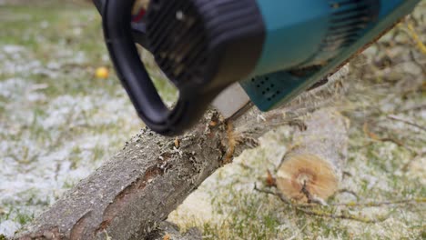 Cutting-log-into-firewood-for-the-heating-season-in-winter---yard-work