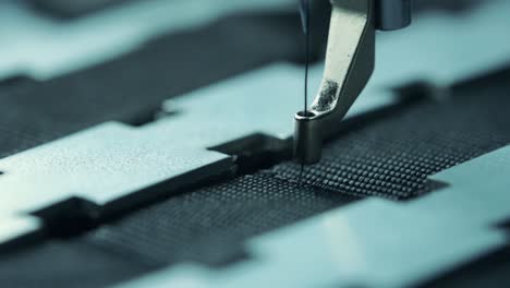 close-up-shot-of-industrial-sewing-machine-when-sewing-material