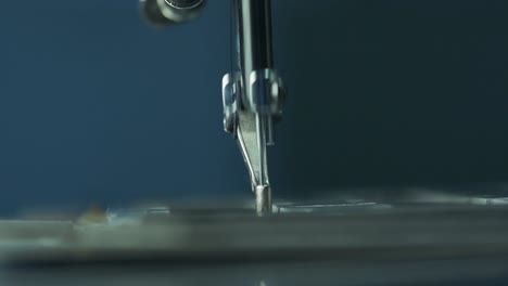 Close-up-shot-of-needle-working-with-industrial-sewing-machine