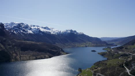 Majestic-aerial-view-across-Norway-Rockies-mountain-range-lake-fjord-valley-wilderness