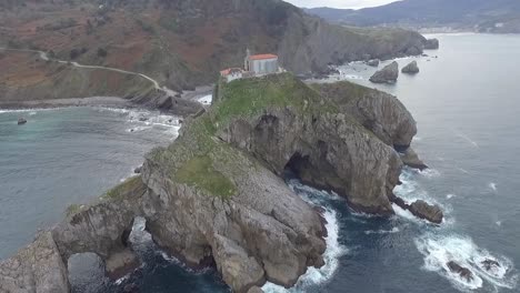 Amazing-Church-on-Coastal-Rock,-Gaztelugatxe-Islet,-Basque,-Spain,-Aerial-Circling