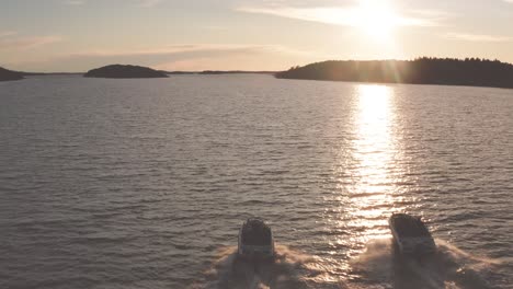 High-speed-boat-chase-from-the-rear-angle---contrast-between-the-setting-sun-and-the-archipelago