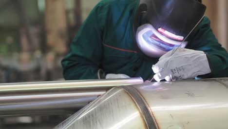 Welder,-using-VIG,-TIG,-MIG-MAG-method-to-welding-stainless-steel-parts,-close-up
