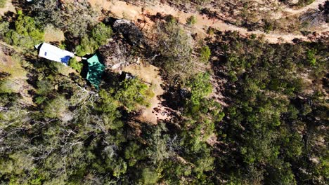 Hikers-In-Mount-Byron,-A-Rural-Locality-And-Mountain-In-Somerset-Region---Queensland,-Australia---top-down-descending-shot,-aerial-drone