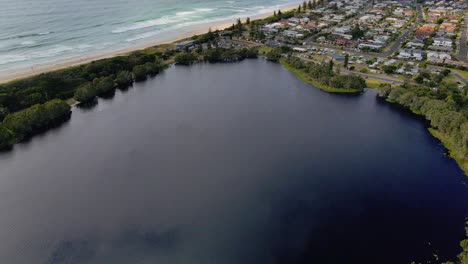 Calm-blue-lake-ainsworth--Seaside--Ti-Tree-Lake--NSW-Australia--Aerial
