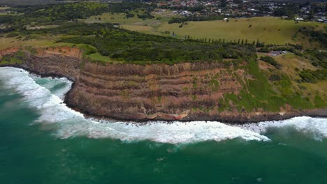 Beautiful-mountain-walls-of-Lennox-Head-Mountain--NSW-Australia--Aerial
