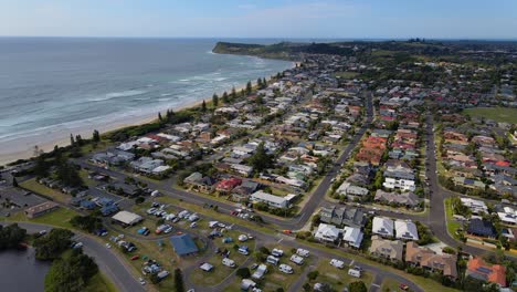 Beach-Houses-Near-Lake-Ainsworth-In-Lennox-Head---Travel-Destination-In-NSW,-Australia---pullback-drone-shot