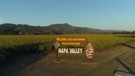 Pan-down-aerial-shot-of-the-welcome-to-the-napa-valley-sign