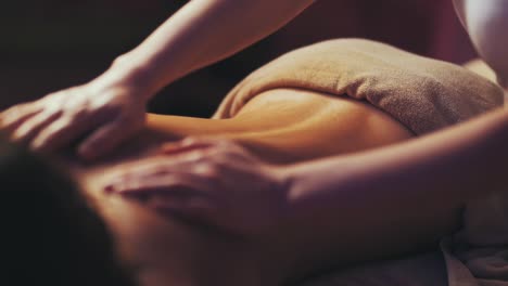 masseur-is-massaging-the-girl's-back