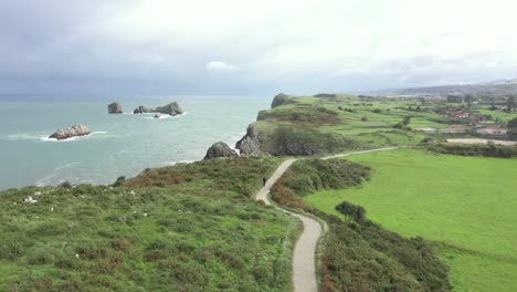 One-person-walks-on-path-above-cliffs