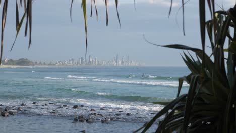 Blue-Ocean-Water-With-Surfers-Enjoying-Summer-Adventure---Burleigh-Heads-Beach---Tourist-Destination-In-Gold-Coast-QLD,-Australia