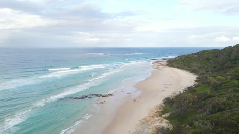 Tourists-Enjoying-Summer-Vacation-On-Sandy-Beach---Headland-In-Point-Lookout,-QLD,-Australia