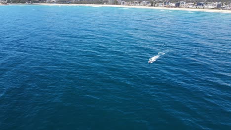 Jet-Skier---Tourist-Jet-Skiing-In-The-Blue-Ocean---Palm-Beach,-Gold-Coast,-QLD,-Australia
