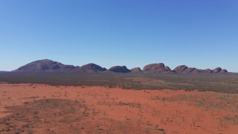 Kata-Tjuta---Mount-Olga-With-Red-Sand-Desert-Landscape-In-Foreground---Domed-Rock-Formations-Or-Bornhardts-In-Northern-Territory,-Australia