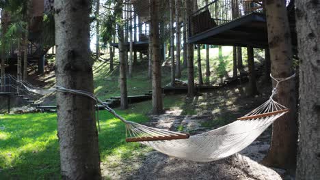 Relaxing-hammock-in-the-middle-of-the-woods-between-two-trees