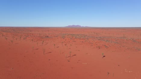 Panorama-Of-Red-Desert-With-Distant-View-Of-Mount-Olgas---Uluru-Kata-Tjuta-National-Park-In-Northern-Territory,-Australia