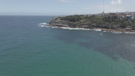 Calm-Blue-Sea-With-Mackenzies-Point-Peninsula-In-Background-In-Tamarama,-NSW,-Australia
