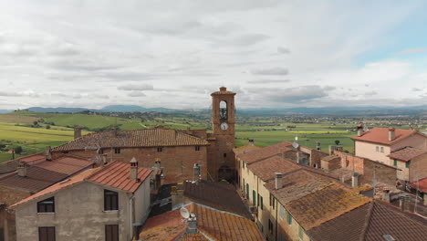 Beautiful-aerial-shot-of-Italian-village-with-landscape-in-the-background,-4k