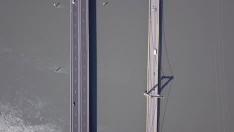 Top-down-View-Of-Vehicles-Crossing-Rhone-River-By-Bridge-In-Roquemaure,-France