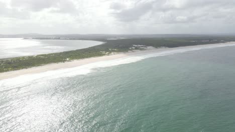 Aerial-View-Of-Calm-Blue-Sea,-Waynderrabah-Beach,-And-Karuah-River-At-Daytime-In-Summer---Jimmys-Beach-Reserve-Near-Hawks-Nest,-NSW,-Australia