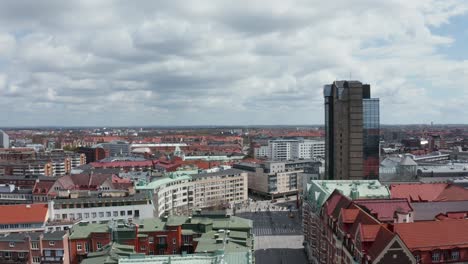 Drone-shot-of-Malmö-during-sunny-day-with-Triangeln-in-frame