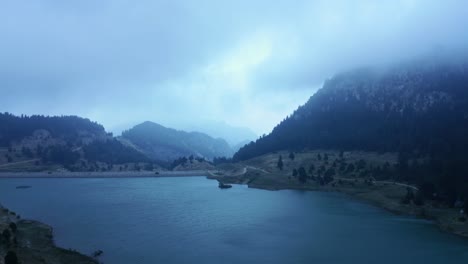Timelapse-of-lake-surrounded-by-mountains-and-trees