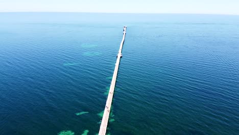 Aerial---drone-shot-of-jetty-stretching-out-to-sea,-Western-Australia