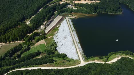 Aerial-shot-of-the-dam-lake-in-the-forest