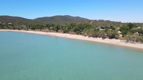 Aerial-View-Of-Calm-Blue-Sea-By-Dingo-Beach-On-A-Sunny-Summer-Day---Beach-At-Whitsunday-Island,-QLD,-Australia