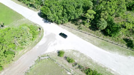 Aerial-view-on-car-driving-through-the-park