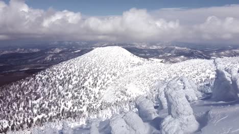 Aerial---drone-establishing-shot-of-the-snow-covered-mountain,-Hakkoda,-Japan