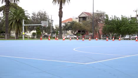 4K-shot-of-temporarily-closed-outdoor-basketball-court-during-pandemic-lockdown