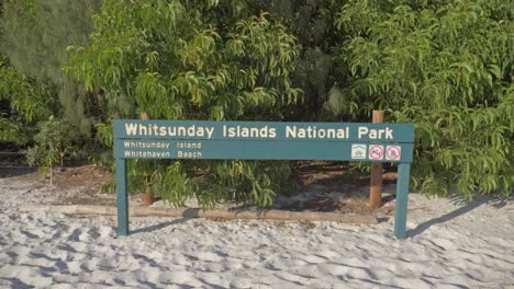 Signage-Board-Of-Whitehaven-Beach-At-The-Sandy-Shoreline-Of-Whitsunday-Island,-Queensland,-North-Australia