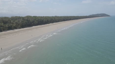 Tropical-Coastal-Landscape-With-Lush-Vegetation-And-Blue-Ocean-At-Four-Mile-Beach,-Port-Douglas,-Queensland,-Australia---aerial-drone-shot