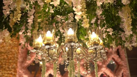 Beautiful-cinematic-rotating-shot-of-a-grand-chandelier-light-in-a-Muslim-wedding-in-India
