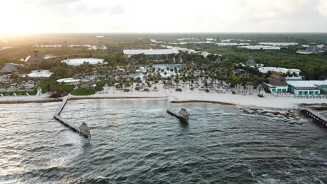 Drone-Towards-Sandy-Palm-Tree-Beaches-In-Vidanta-Riviera-Maya,-Quintana-Roo,-Mexico