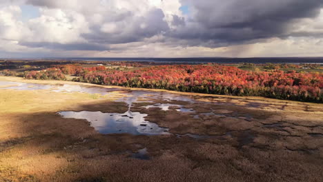 Drone-footage-of-cloud-shadows-moving-over-fall-landscape