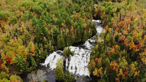 Drone-footage-above-a-waterfall-in-autumn-in-northern-Michigan