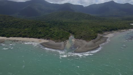 Aerial-View-Of-Sand-Beach-and-Rainforest-at-Cape-Tribulation-in-Queensland,-Australia---drone-shot