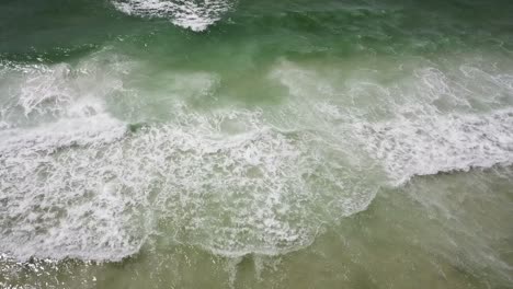 Splashing-Foamy-Waves-Of-The-Sea-In-Summer---aerial-drone-shot