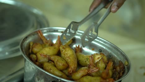 Slow-motion-cinematic-shot-of-grilled-fried-prawn-served-in-a-dinner-or-wedding-reception