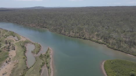 Aerial-View-Of-Boyne-River-With-Dense-Forest-At-Tannum-Sands-In-QLD,-Australia