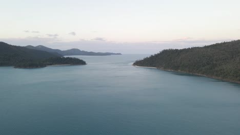 Secluded-Anchorage-With-Densely-Forested-Hills-At-Dusk