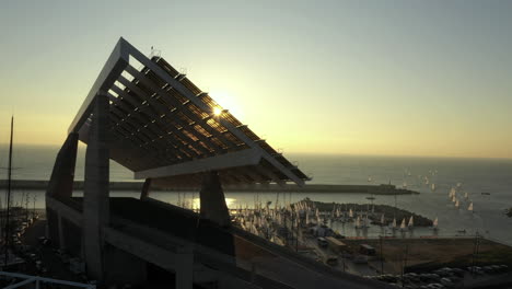 Panel-for-solar-energy-at-Forum-park-of-Barcelona-port-at-sunset