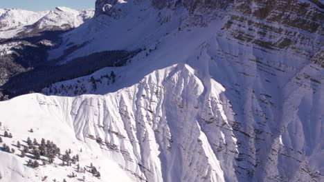 Grand-mountain-face-rock-wall-in-Italian-Dolomites-during-winter-season