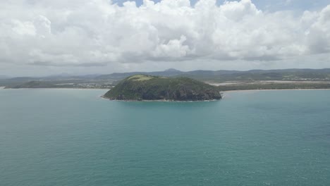 Panorama-Of-Capricorn-Coast-National-Park-And-Calm-Blue-Sea-In-The-Foreground-At-Summer