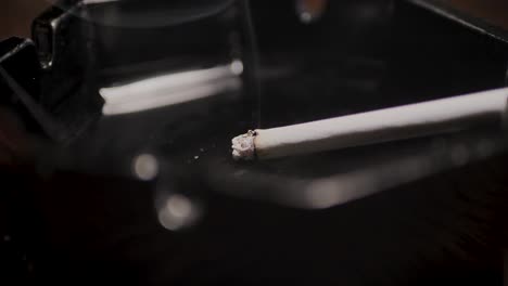 Close-up-smoking-cigarette-on-man-hand